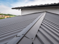 close-up-photo-of-gray-colored-roofing-on-a-house.-What-Color-Metal-Roof-Fades-The-Least