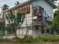 immaculate-white-house-in-the-middle-of-the-forest