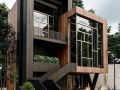 glass front with long span pvc wood panels and long span black pvc panels